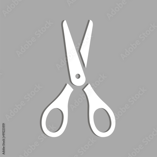 Icono de tijeras sobre un fondo gris