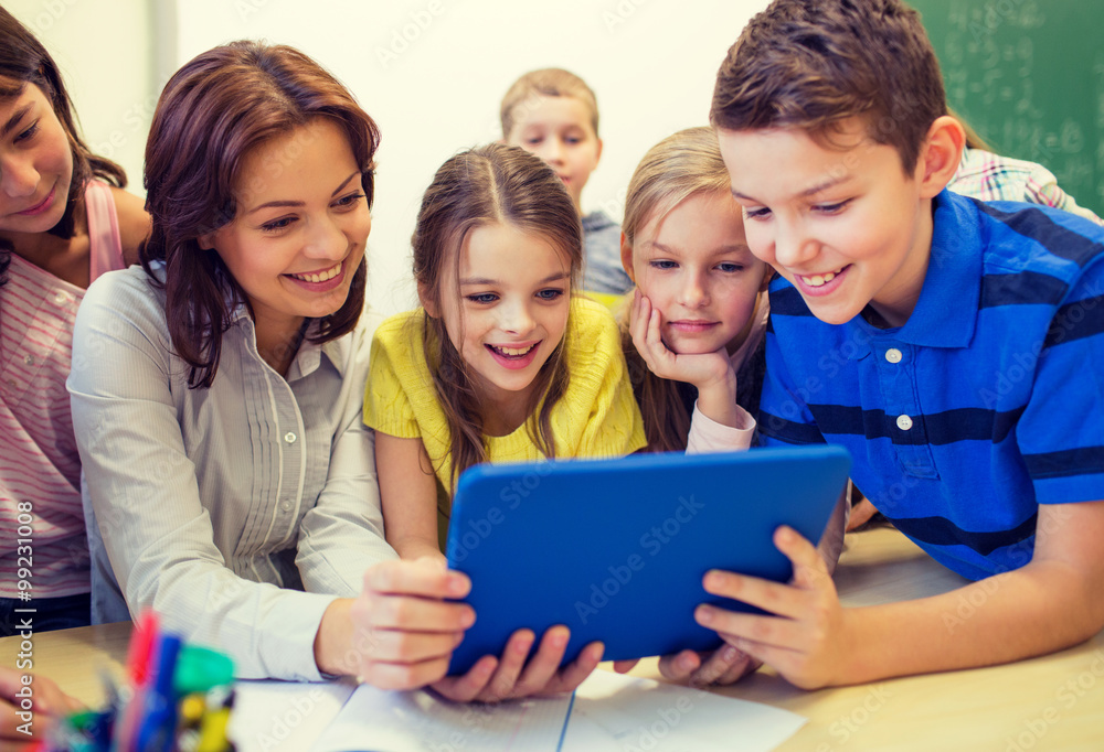 group of kids with teacher and tablet pc at school group of kids with teacher and tablet pc at school