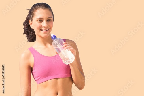 Composite image of fit woman with water © vectorfusionart