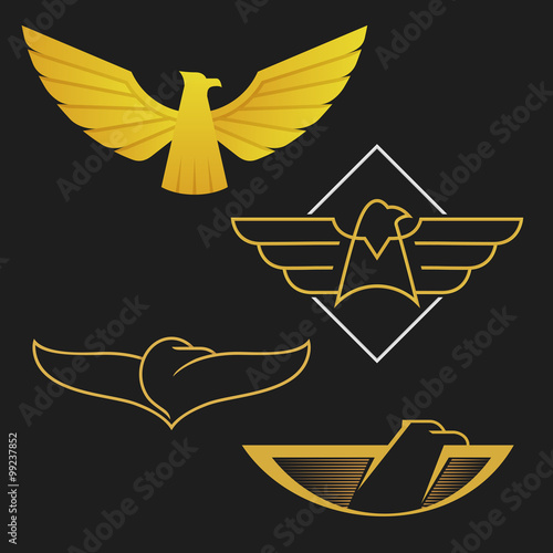 The set of eagles logo icon design. Abstract golden eagles on the dark background.
