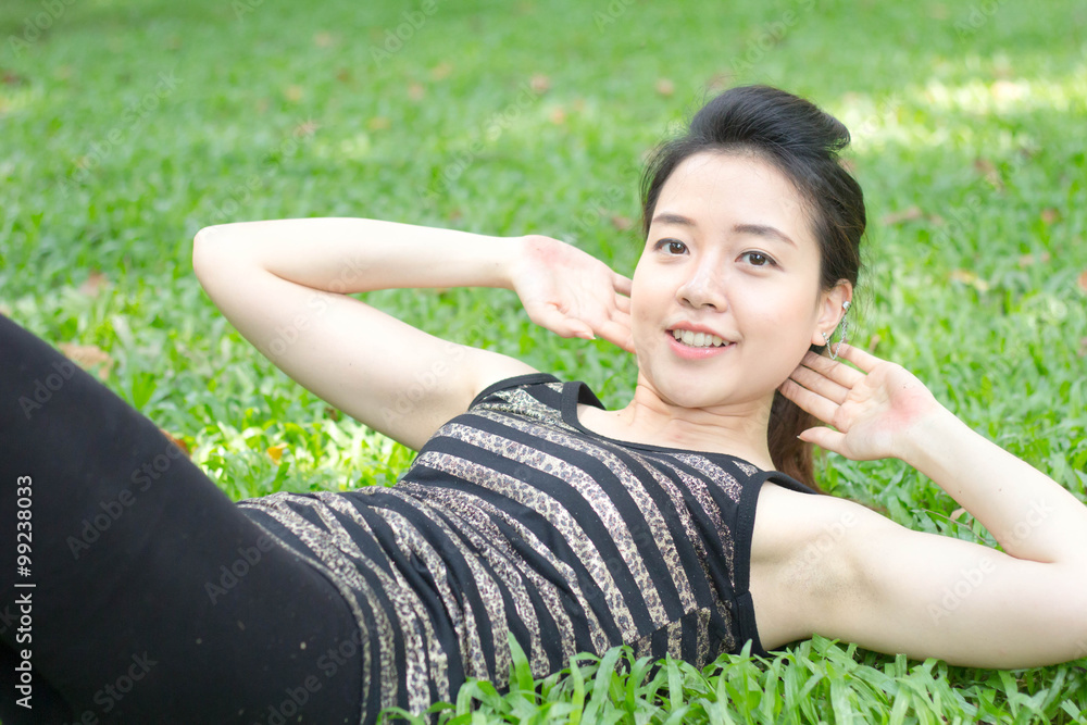Portrait of thai adult beautiful girl doing yoga exercises in the park Portrait of thai adult beautiful girl doing yoga exercises in the park