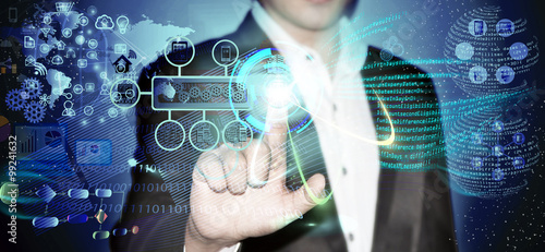 Valokuva Virtual image of a Business man touching the process of triggering a software development process, which it connects the various systems globally through a single touch in a network and coding phase