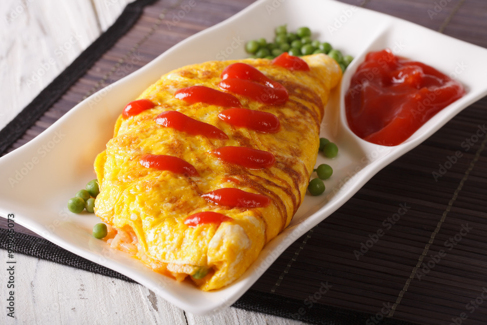 Delicious omelette with ketchup close-up on a plate. Horizontal
Delicious omelette with ketchup close-up on a plate. Horizontal