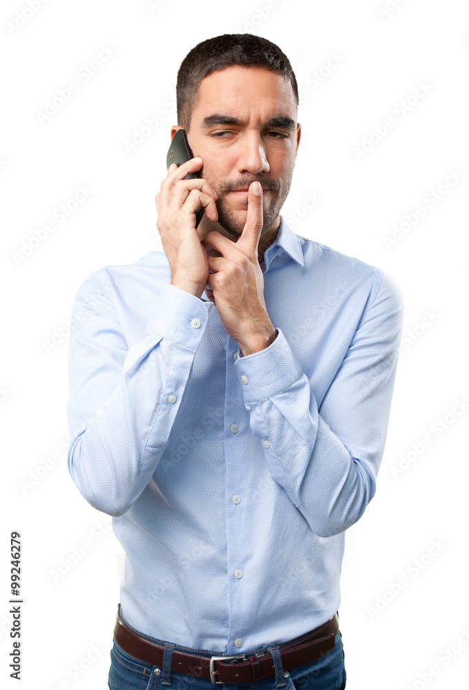 Pensive man using a mobile phone Pensive man using a mobile phone