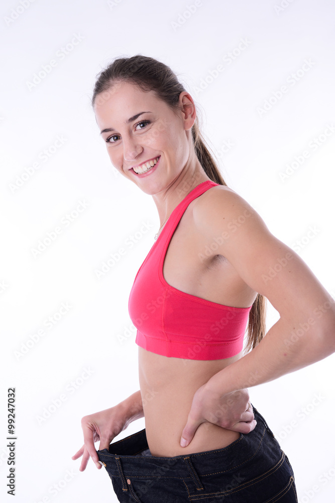 beautiful young woman trying pants after diet weight loss program beautiful young woman trying pants after diet weight loss program