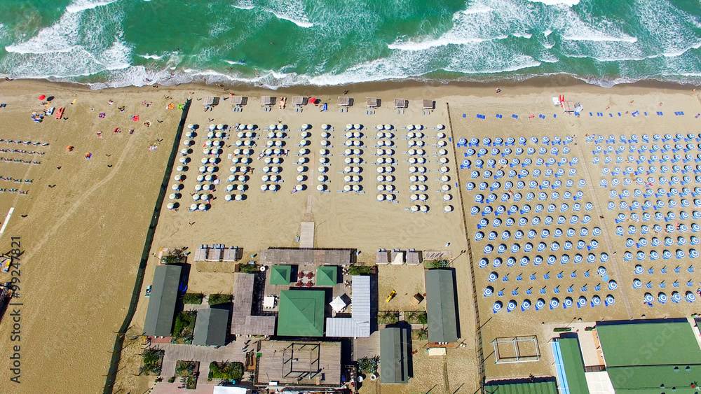 Beach umbrellas and chairs on the beach. Aerial bird eye view