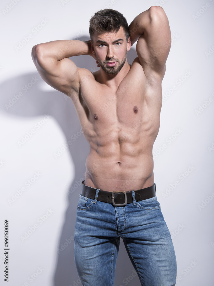 handsome young bodybuilder with toned body posing shirtless handsome young bodybuilder with toned body posing shirtless