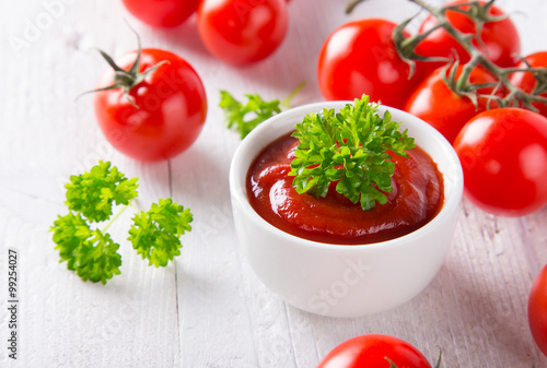 Bowl of tomato sauce and ch...