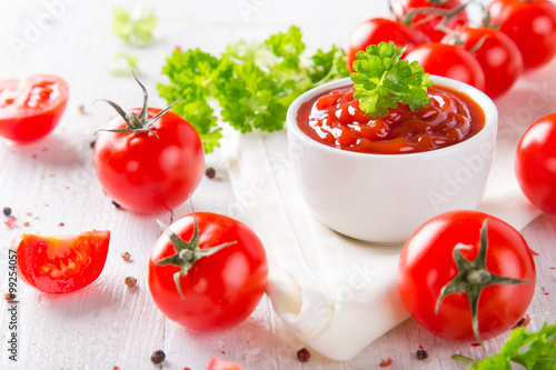 Bowl of tomato sauce and ch...
