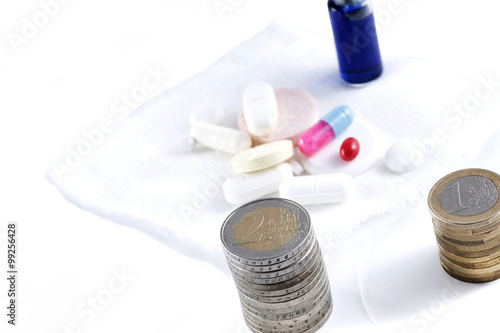 conceptual image with medicine and money.