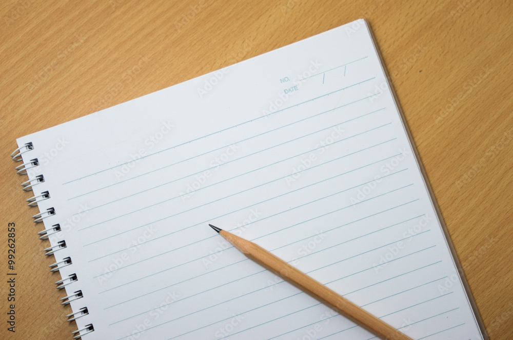 white paper and pencil on wooden background white paper and pencil on wooden background