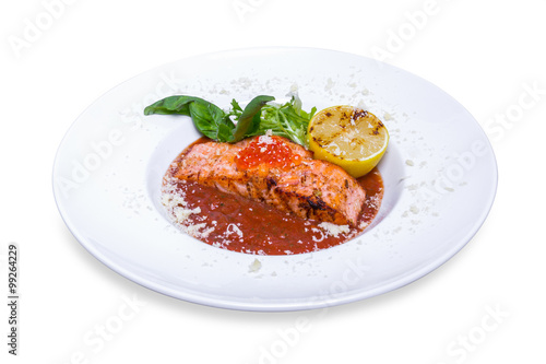 Salmon in red tomato sauce with caviar, isolated with clipping path