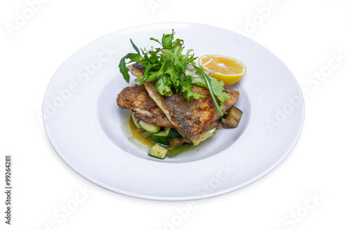 Cooked dorado fish with vegetables, isolated with clipping path