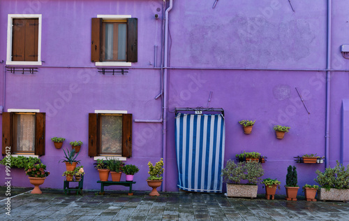 Colorful house facade in Burano, Italy © XtravaganT