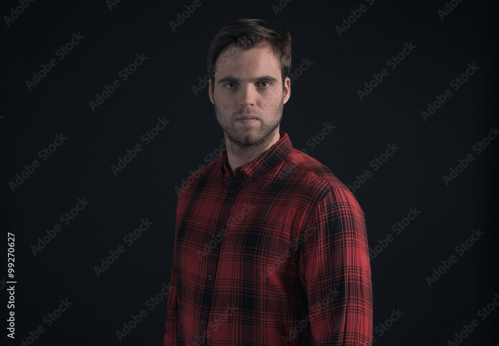 Hipster lumberjack fashion man in red checkered shirt.