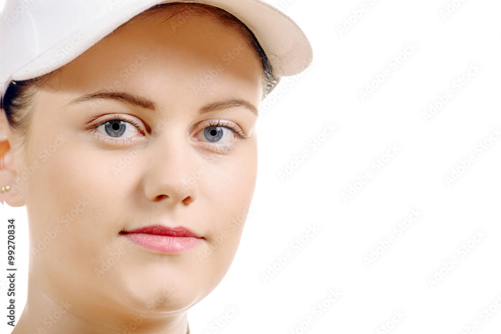 close up of the face of a pretty young woman with a white cap close up of the face of a pretty young woman with a white cap