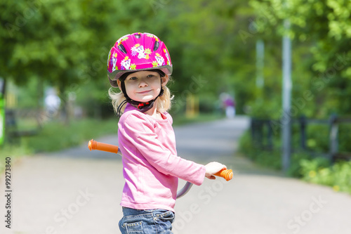 little girl with a scooter