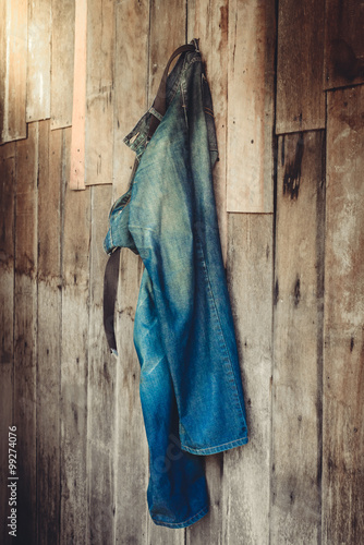 Vintage,Jeans hanging on the wall photo