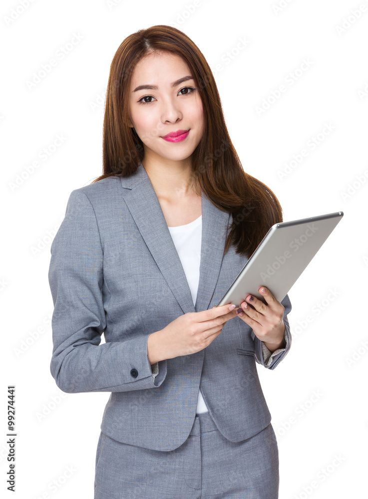 Asian Young Businesswoman use of the tablet pc Asian Young Businesswoman use of the tablet pc
