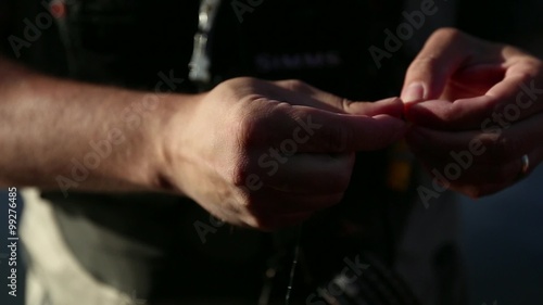 Fisherman Tying a Fly