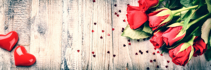 Bouquet of red roses with decorative heart. St Valentine's conce