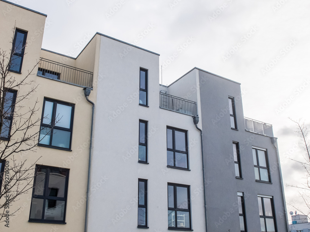 Fototapeta premium Modern Townhouses Under Overcast Sky