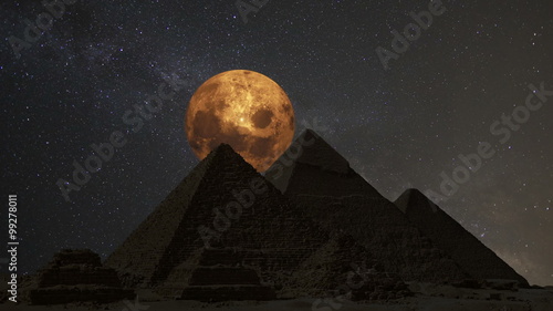 Supermoon over the great pyramids, Cairo, Egypt.  (Time lapse. Animation. Montage) photo