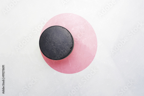 old hockey puck is on the ice with japan flag