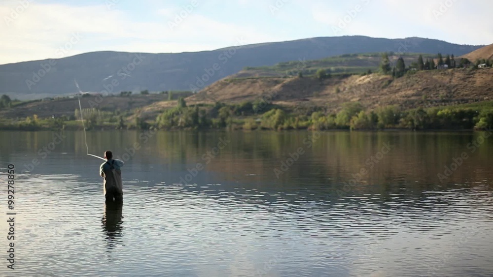Fly fisherman Casting in Sunlight Fly fisherman Casting in Sunlight