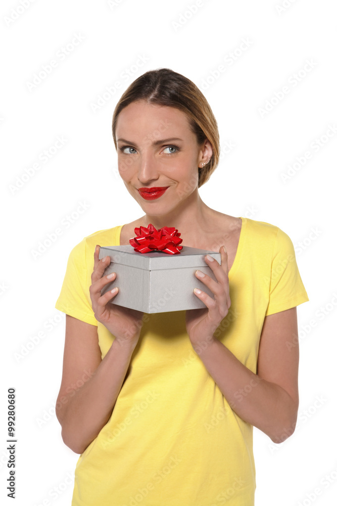 Beautiful young woman holding a gift box Beautiful young woman holding a gift box