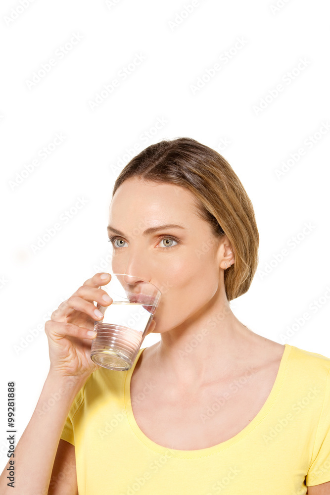 Woman holding a glass of fresh water Woman holding a glass of fresh water