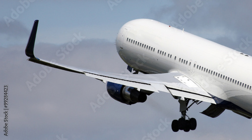 big white jet lifting off