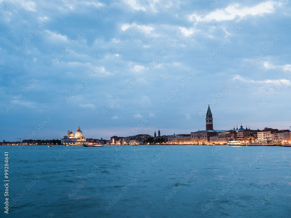 A view over the beautiful and romantic city skyline of Venice in Italy at dusk.
