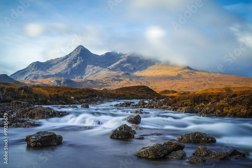 River Sligachan and the mountains of Sgurr nan Gillean on a cloudy day at Isle of Skye - Scotland, UK