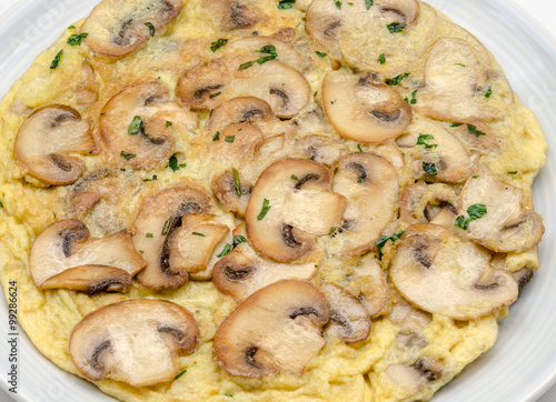 Delicious omelet with mushrooms and tomatoes