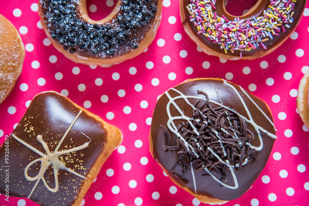Artisan donuts on dotka pink background Artisan donuts on dotka pink background