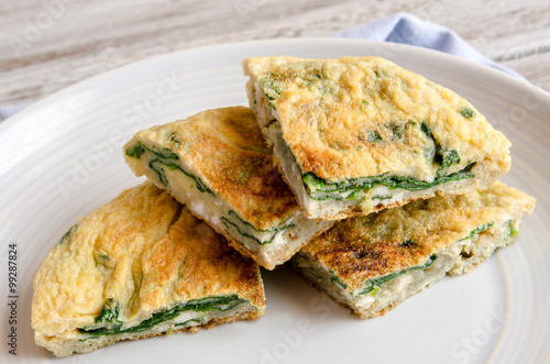 Omelet with spinach on plate