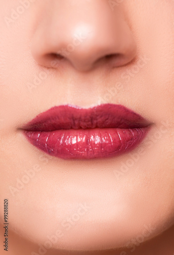 Close up portrait of beautiful young woman face, red lips