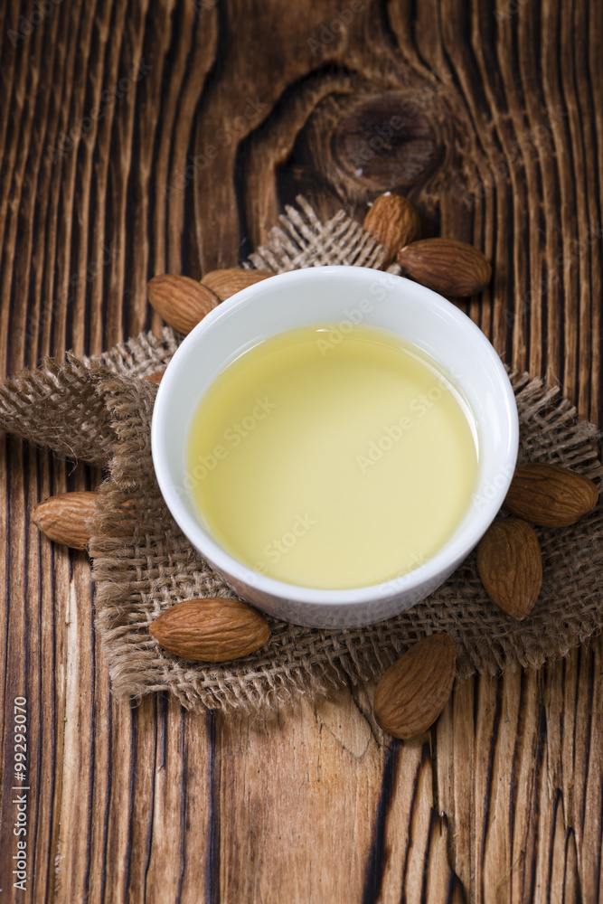 Bowl with almond oil (selective focus) Bowl with almond oil (selective focus)