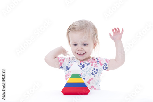 toddler girl stacking blocks