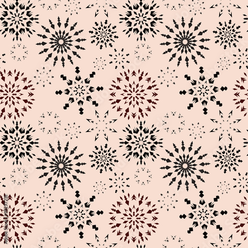 Christmas seamless pattern. Brown snowflake signs on light beige background. Winter theme retro texture. Chocolate snow. Vector illustration.