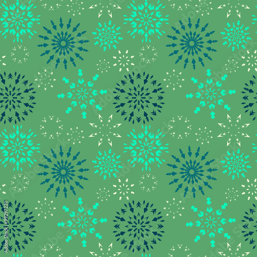 Christmas seamless pattern. Dark and light blue snowflakes on green background. Winter theme retro texture. Vector illustration.