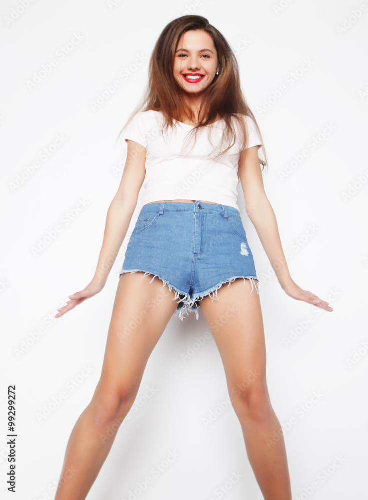 Naklejka premium smiling young woman jumping in air