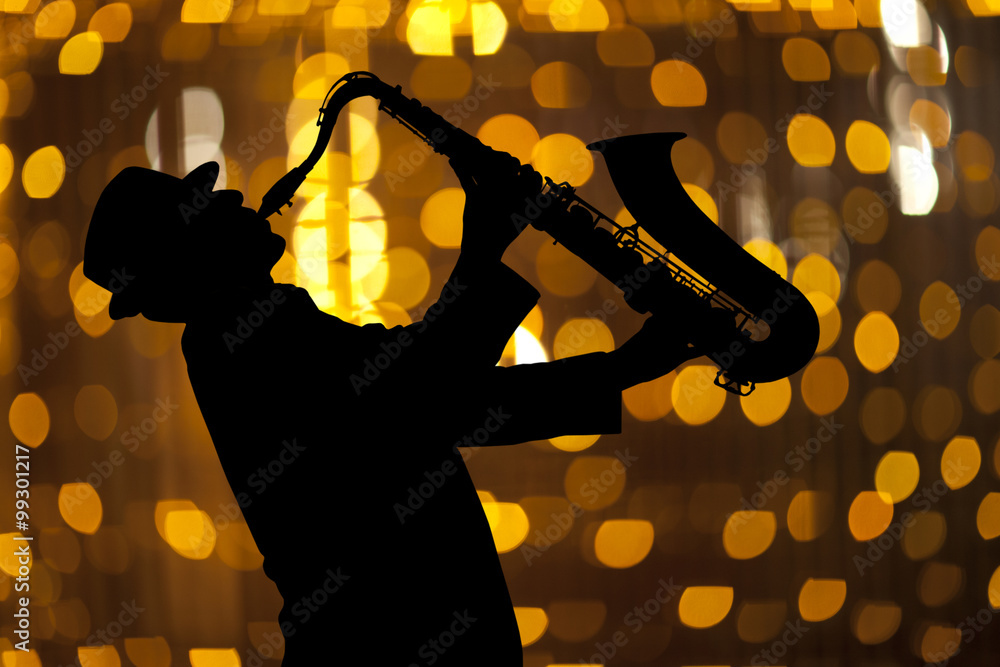 Obraz premium Saxophonist. Man playing on saxophone