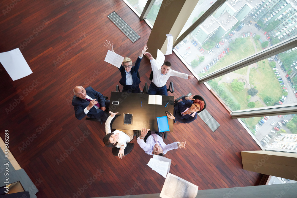 top view of business people group throwing dociments in air top view of business people group throwing dociments in air