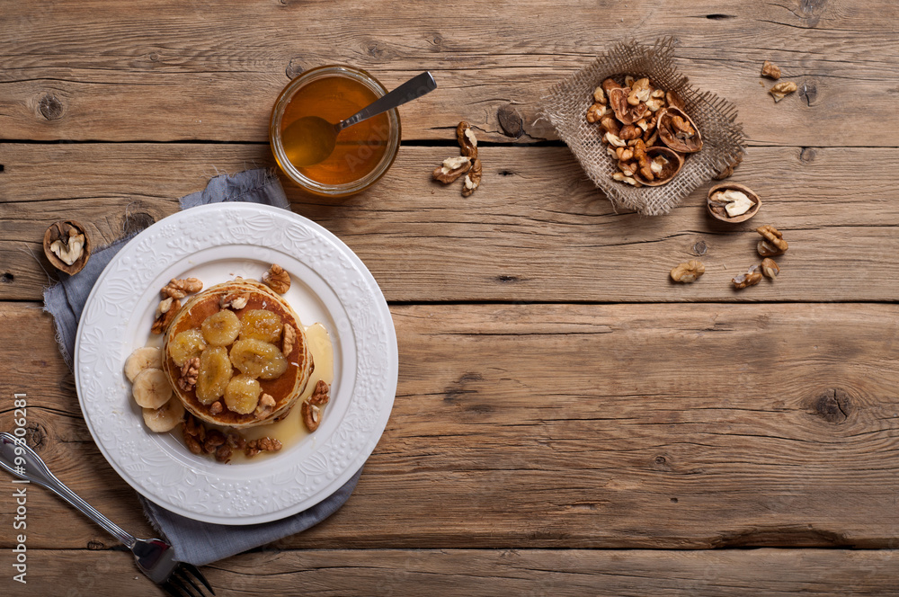 Pancake with nuts, honey and caramelized bananas Pancake with nuts, honey and caramelized bananas