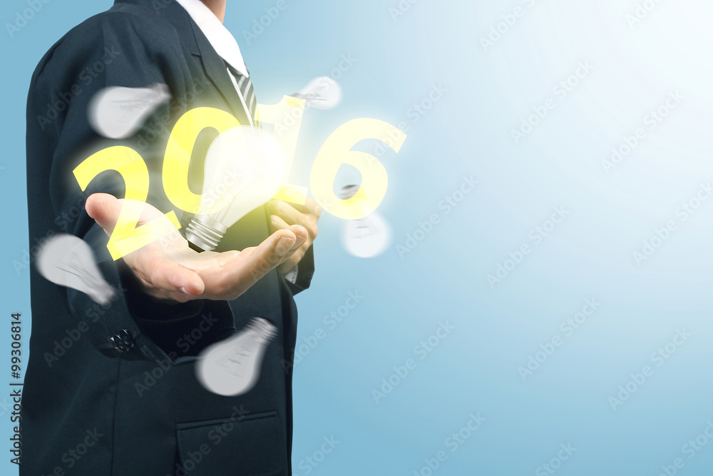 Businessman with light bulb and number 2016 Businessman with light bulb and number 2016