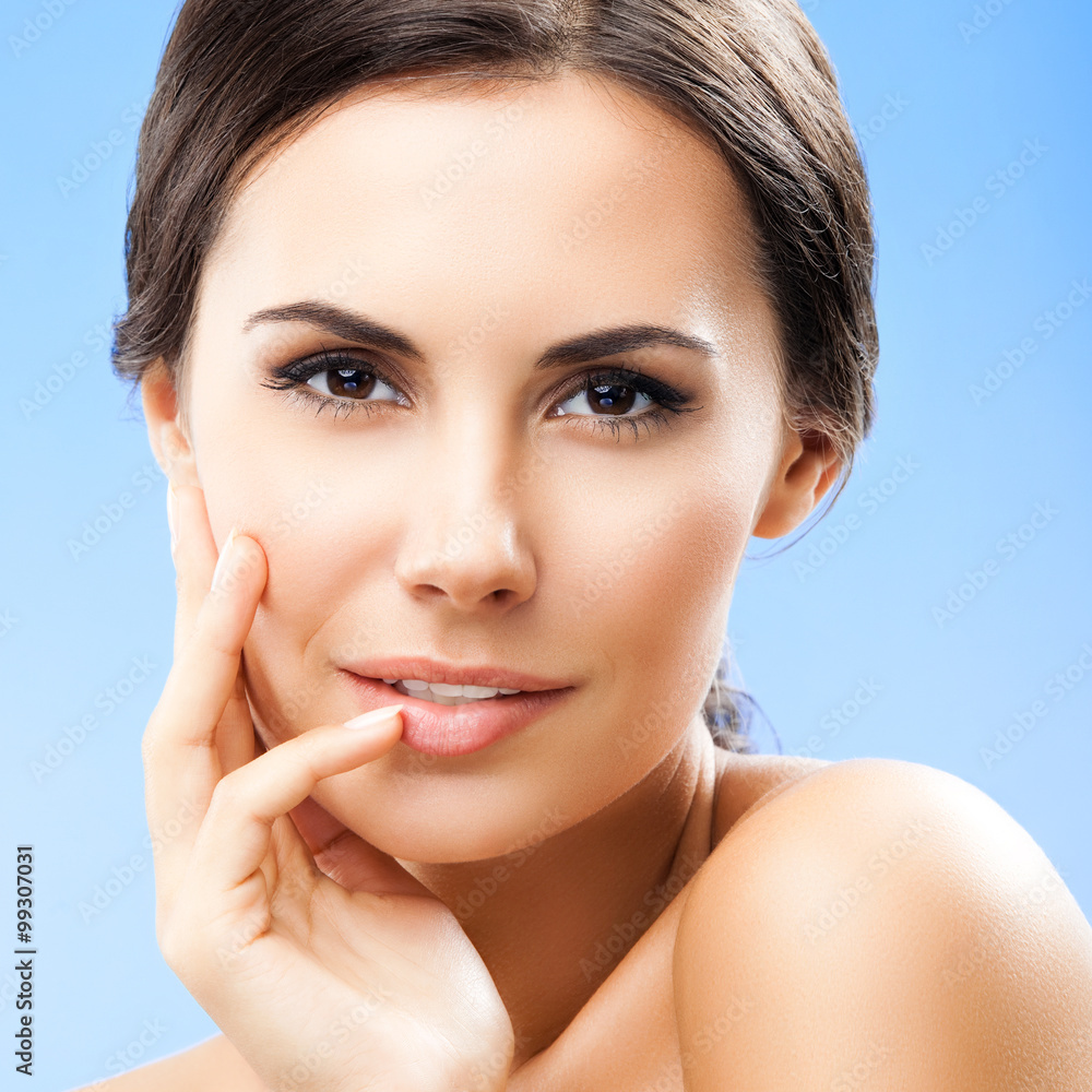 portrait of woman with naked shoulders, on blue portrait of woman with naked shoulders, on blue