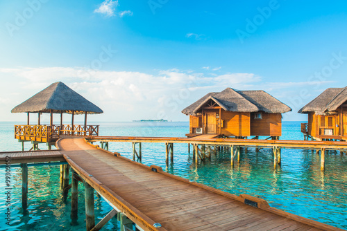 Over water bungalows with steps into amazing green lagoon 