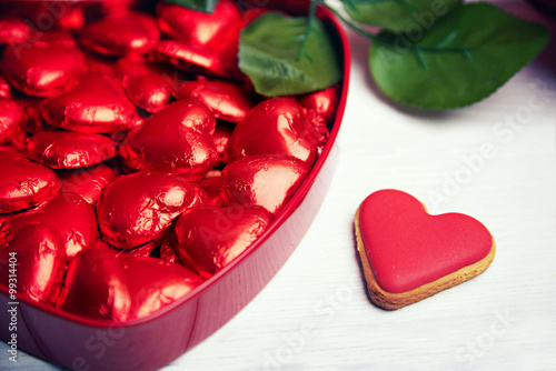Chocolate pralines in red heart shaped gift box